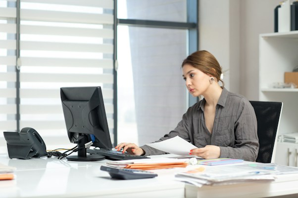a girl looking at monitor